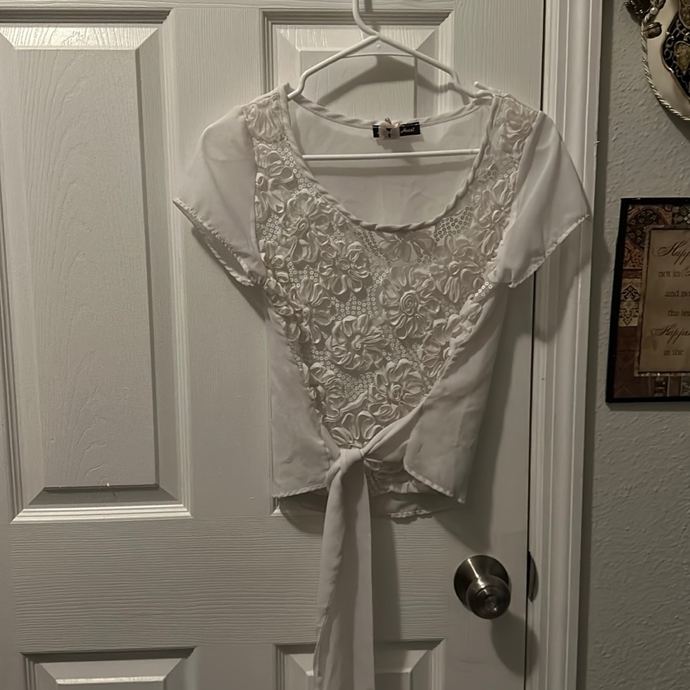 White . Very attractive raised flowers, sequins  tie front top.
